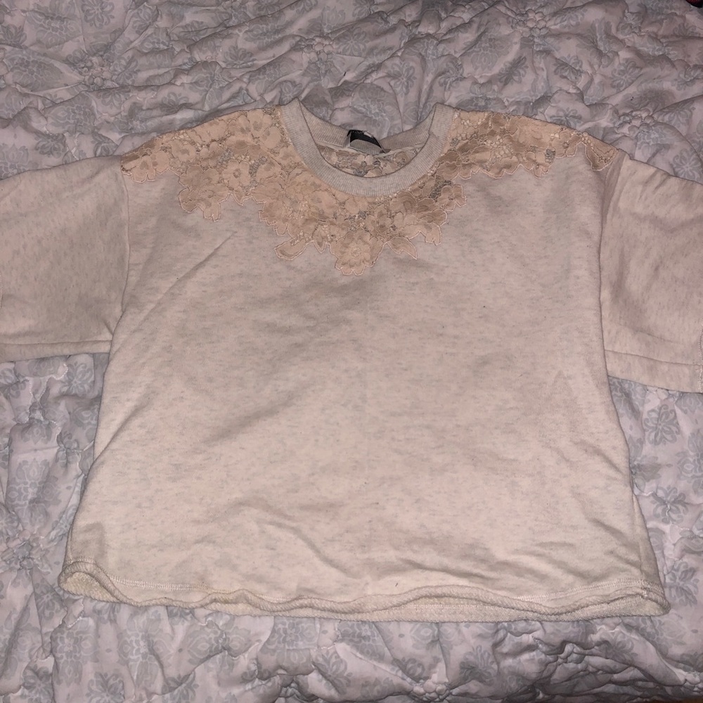 Cream Cropped sweatshirt with lace accents